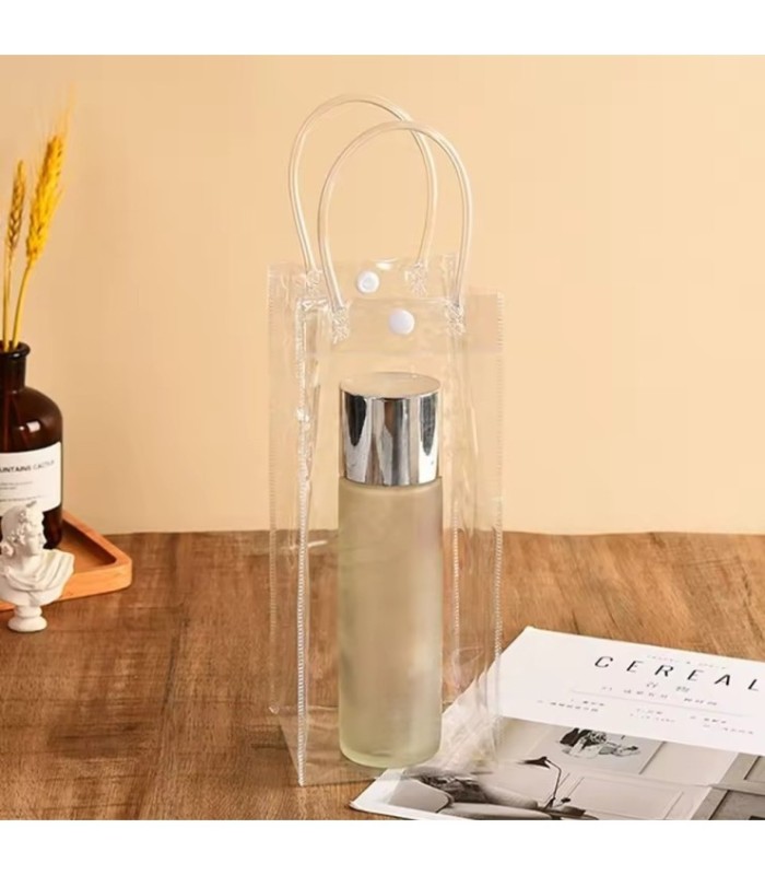 BOLSO TRANSPARENTE CON BOTON 25x10x10CM